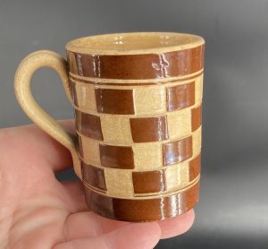 0614:: 1910s Bohemia, checkerware espresso mug, brown, cylindrical form: 3”H.