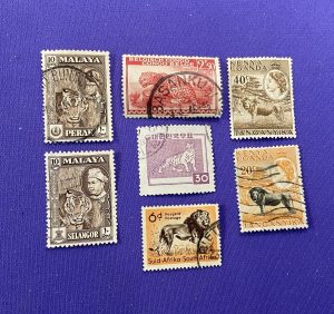 1090:: 7 Animal Stamps, Malaya Tigers, Lions from Tanganyika & S. Africa, Belgian Congo Leopard