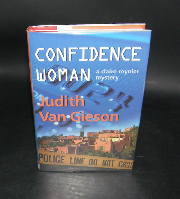 1677:: -SIGNED- 1st Edition 2002: "Confidence Woman: A Claire Renier Mystery" by Judith Van Gieson