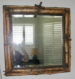 3146:: Mirror, wall-hung, ca.1880s, American folk art, square form, comprised of wooden boards with applied bark-on birch and cherry branches and twigs including a cruciform apex twig element, houses beveled mirrored glass. Dimensions:  22½” square
