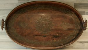 3151:: Oval serving tray, ca.1800, Moorish Ottoman Empire Syrian, viniferous silver overlay on European walnut, conforming gallery edge, open turned grip handles at each end, rests flat, original patina, waxed.  Dimensions:  16”W,  27”L