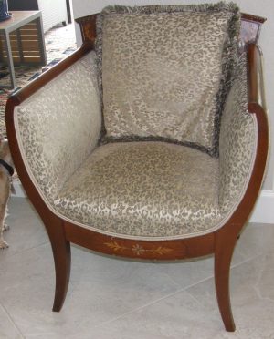 3167::  Antique lolling chair, Edwardian ca.1910, English, curule form mahogany frame reupholstered in Grade-A animal pattern fabric overall
